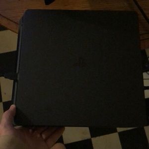 Brand new PlayStation 4 with wires and controller